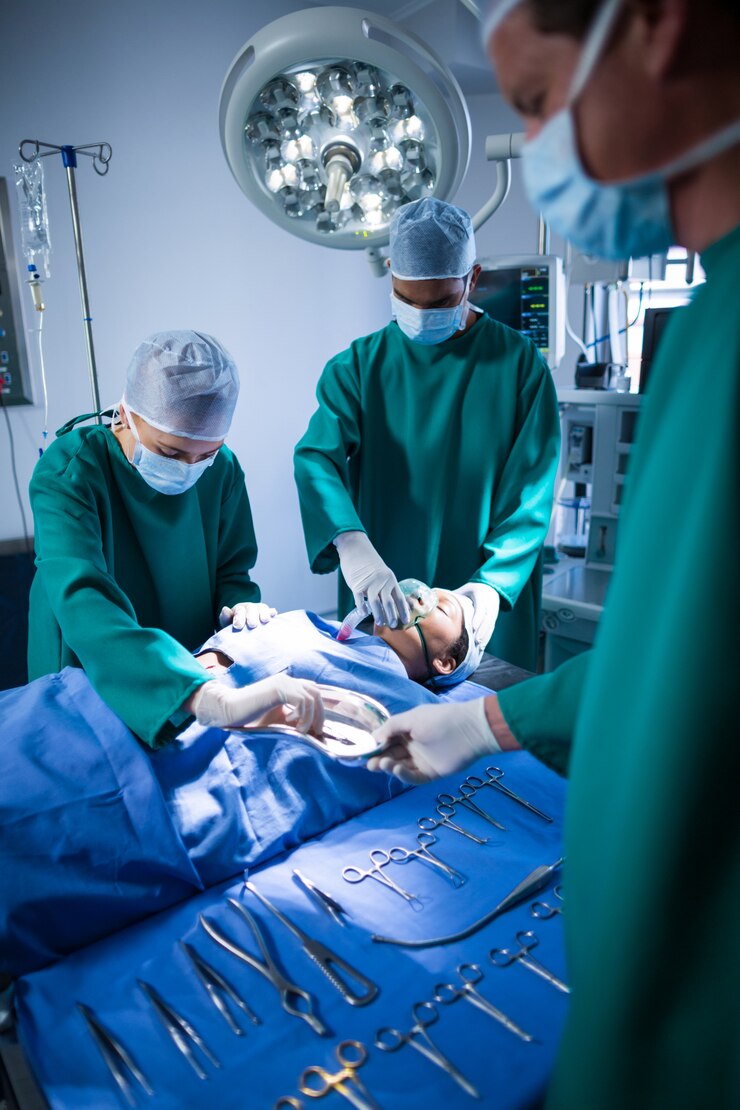 surgeons-performing-operation-operation-theater_107420-64875