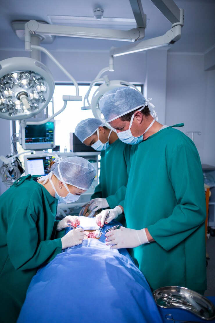 surgeons-performing-operation-operation-theater_107420-64883
