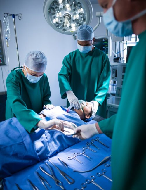 surgeons-performing-operation-operation-theater_107420-64875