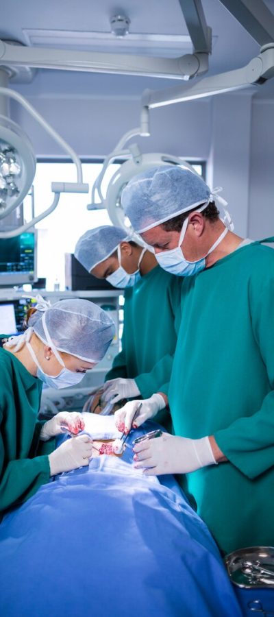 surgeons-performing-operation-operation-theater_107420-64883